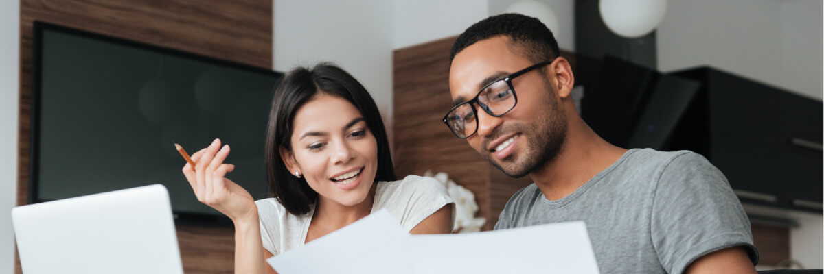 Man and Woman reviewing mortgage documents.